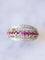 Bague Bague bandeau vintage en or gris, rubis, et diamants 58 Facettes