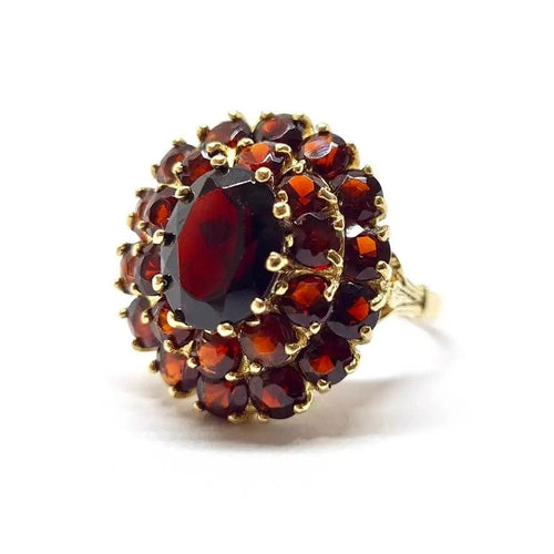 Bague Bague ancienne fleur grenats or jaune 58 Facettes