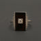 Bague Bague Art Déco en or gris, onyx et diamant "Blink" 58 Facettes 1966