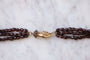 Collier Sautoir fermoir main en or et perles de grenat 58 Facettes