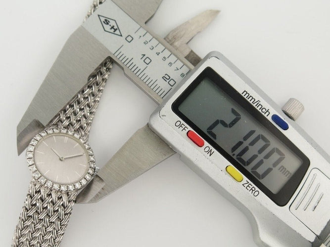 Montre vintage montre BOUCHERON mvt omega 21mm mecanique or gris 18k et diamants 58 Facettes 241077