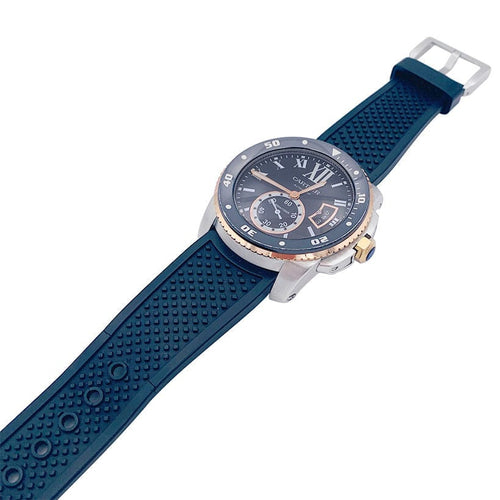 Montre Montre Cartier Calibre en or et acier sur bracelet caoutchouc. 58 Facettes 32552