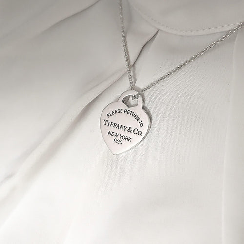 Pendentif TIFFANY & CO - Pendentif  "Please return to" argent 58 Facettes 25394