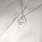 Pendentif TIFFANY & CO - Pendentif  "Please return to" argent 58 Facettes 25394