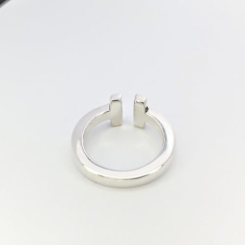 Bague TIFFANY & CO - Bague modèle "T" argent 58 Facettes 25380