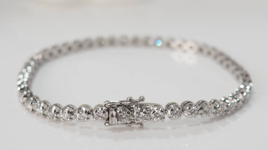 Bracelet Bracelet rivière en or blanc et diamants sertis clos 58 Facettes 31743