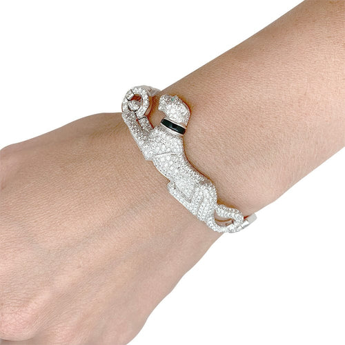 Bracelet Bracelet Cartier "Panthère de Cartier" en or blanc, diamants, émeraude et onyx. 58 Facettes 31544