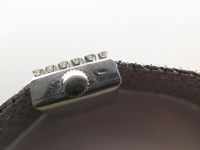 Montre vintage montre EBEL carre en or blanc 18k et diamants 0.4ct mecanique 58 Facettes 250142