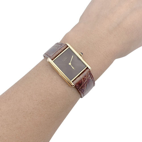 Montre Montre Cartier "Tank Must" argent plaqué or, cadran laqué marron. 58 Facettes 33541