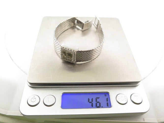 Montre vintage montre EBEL carre en or blanc 18k et diamants 0.4ct mecanique 58 Facettes 250142