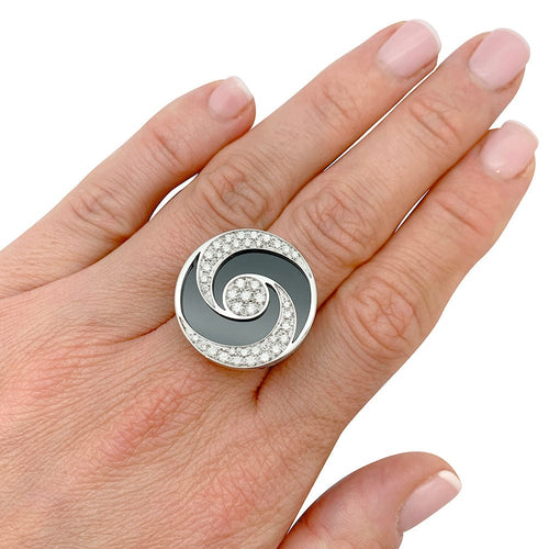 Bague 53 Bague Bulgari "Hypnotique" plateau tournant or blanc et acier, onyx et diamants. 58 Facettes 31216
