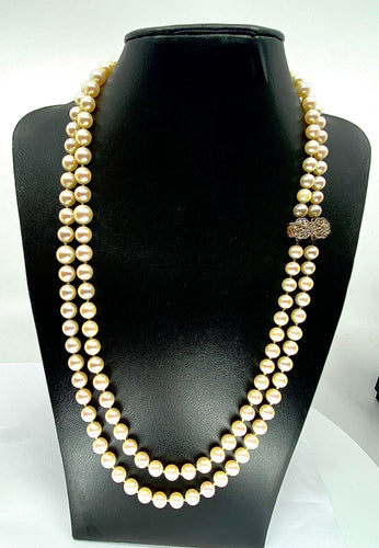 Collier Double collier de perles fermoir diamants. 58 Facettes AB170