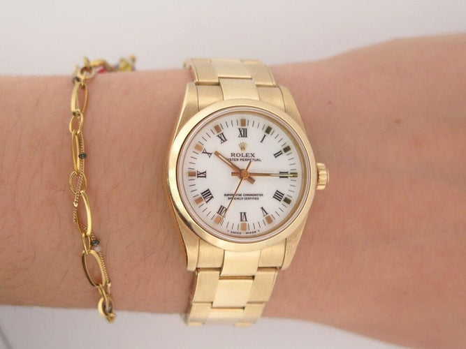 Montre vintage montre ROLEX oyster perpetual 67488 31 mm automatique or jaune 18k 58 Facettes 252911