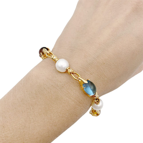 Bracelet Bracelet Bulgari en or jaune, perles, pierres de couleur. 58 Facettes 33083