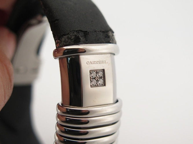 Montre vintage montre CARTIER declaration titane & acier 4 diamants 0.12ct quartz 58 Facettes 254101