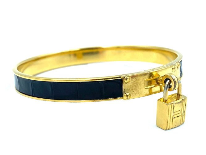 Bracelet Hermès. Bracelet Kelly métal doré et cuir 58 Facettes