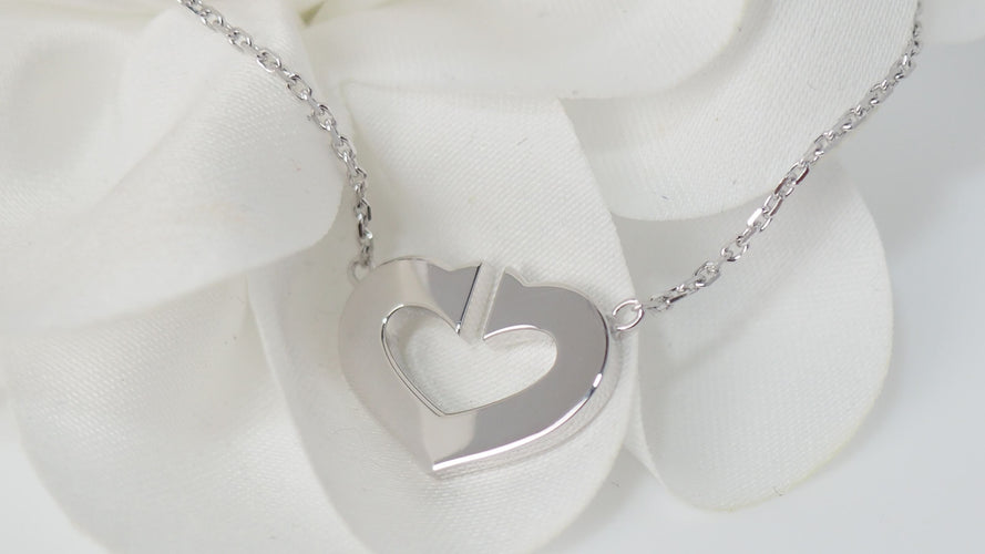 Collier Collier Cartier Symboles cœur en or blanc 58 Facettes