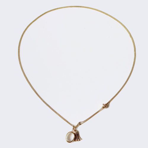 Collier Sautoir ancien en or accompagné de son médaillon, son pompon et son coulant 58 Facettes 17-076