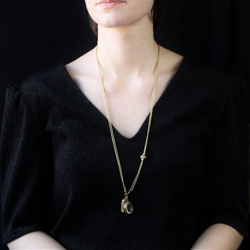 Collier Sautoir ancien en or accompagné de son médaillon, son pompon et son coulant 58 Facettes 17-076