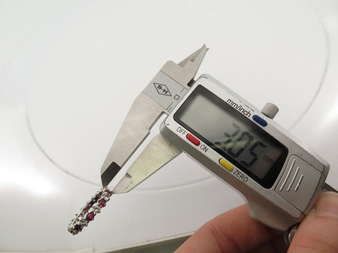 Bague 54 bague alliance 10 diamants et rubis empilable t54 or blanc 18k 58 Facettes 256926