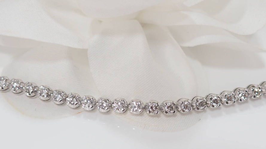 Bracelet Bracelet rivière en or blanc et diamants sertis clos 58 Facettes 31743