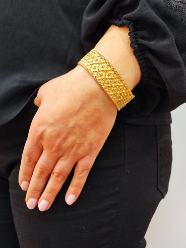 Bracelet Bracelet manchette or jaune Années 60 58 Facettes RA-94