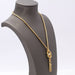 Collier collier flocage or jaune et perles 58 Facettes E359391