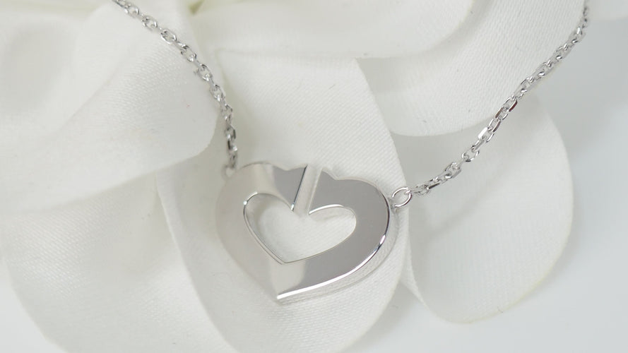 Collier Collier Cartier Symboles cœur en or blanc 58 Facettes
