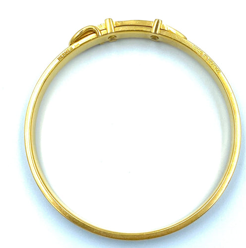 Bracelet Hermès. Bracelet jonc métal doré et cuir 58 Facettes