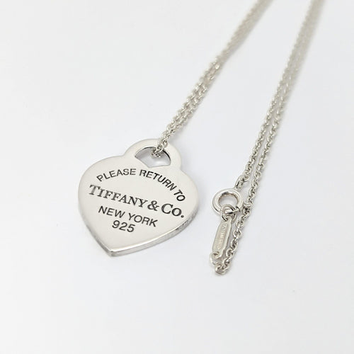 Pendentif TIFFANY & CO - Pendentif  "Please return to" argent 58 Facettes 25394