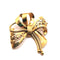 Broche Broche Noeud or jaune 58 Facettes
