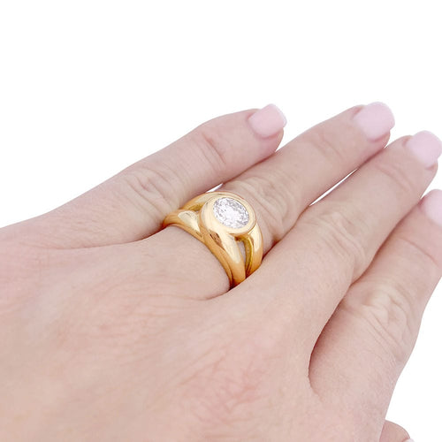 Bague 50 Bague entrelacée or jaune sertie d'un diamant. 58 Facettes 33603