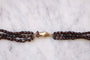 Collier Sautoir fermoir main en or et perles de grenat 58 Facettes