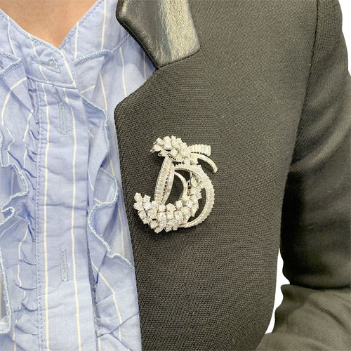 Broche Broche "Volute" en platine or blanc, diamants. 58 Facettes 31490