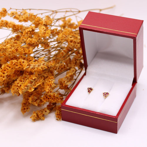 Boucles d'oreilles Boucle d’oreille clous en or jaune et trilogie rubis 58 Facettes