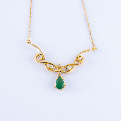 Collier Collier Volutes en or jaune, émeraude diamants 58 Facettes ALGU04