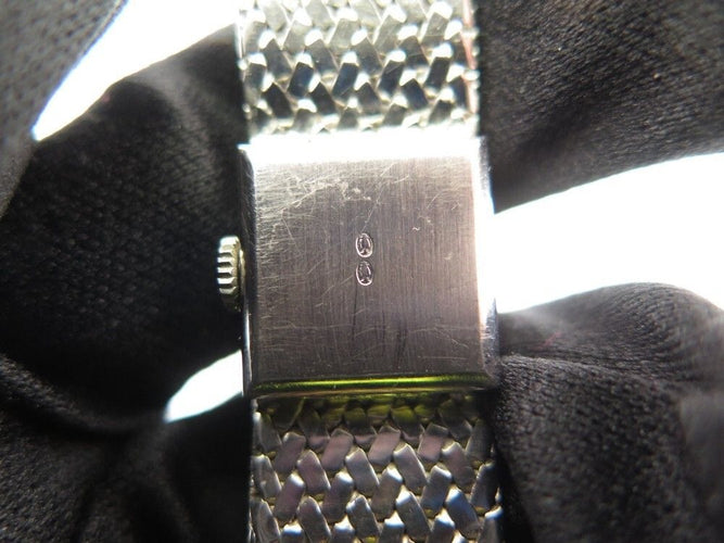 Montre vintage montre EBEL carre en or blanc 18k et diamants 0.4ct mecanique 58 Facettes 250142