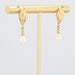 Boucles d'oreilles Boucles d'oreilles pendantes or jaune perle 58 Facettes 19-456A