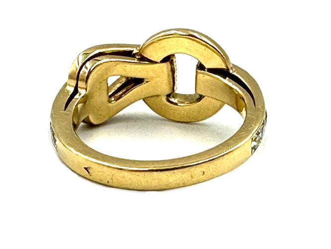 Bague 52 CARTIER. Collection Agrafe, bague en or jaune et diamants 58 Facettes