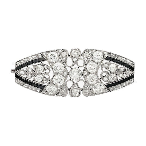 Broche Broche Art Déco en platine sertie de diamants et d'onyx. 58 Facettes 32080