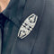 Broche Broche Art Déco en platine sertie de diamants et d'onyx. 58 Facettes 32080