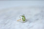 Bague Bague Belle Epoque Péridot entourage diamants 58 Facettes