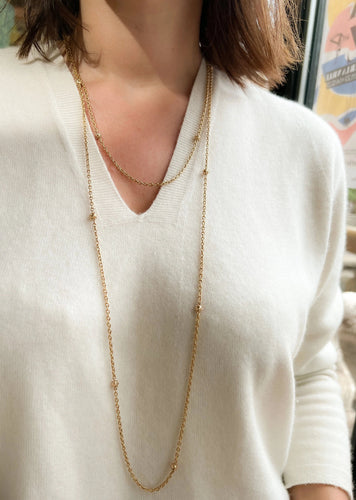 Collier Sautoir ancien en or jaune orné de petites boules 58 Facettes 1