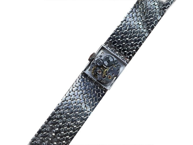 Montre vintage montre EBEL carre en or blanc 18k et diamants 0.4ct mecanique 58 Facettes 250142