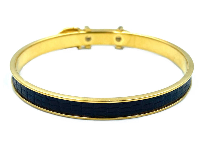 Bracelet Hermès. Bracelet jonc métal doré et cuir 58 Facettes