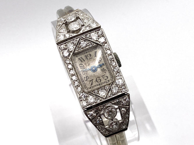 Montre Montre Art Déco platine & or blanc, diamants 2.44 cts 58 Facettes 07/07 - 16