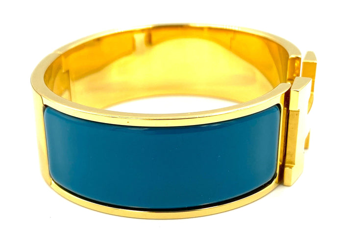 Bracelet HERMÈS. Bracelet métal doré et émail 58 Facettes