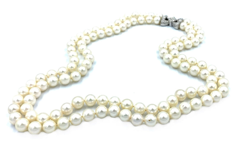 Collier Bucherer. Important collier double rangs perles et diamants 58 Facettes
