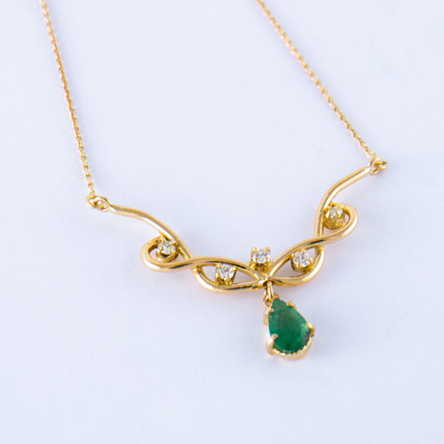 Collier Collier Volutes en or jaune, émeraude diamants 58 Facettes ALGU04