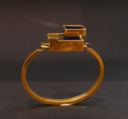 Bracelet Bracelet en métal doré et plexis bleu clair et bleu foncé. 58 Facettes 1035055